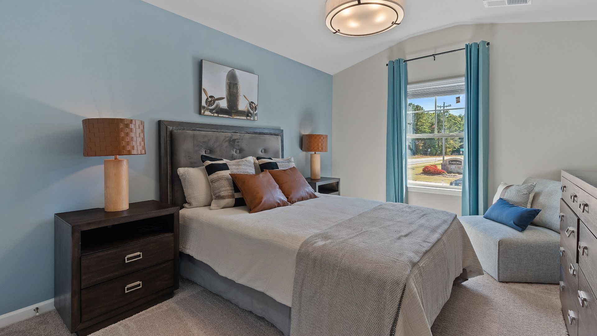 Secondary bedroom with carpet flooring and natural light in the McKinley II at Brighton in Locust Grove, GA.