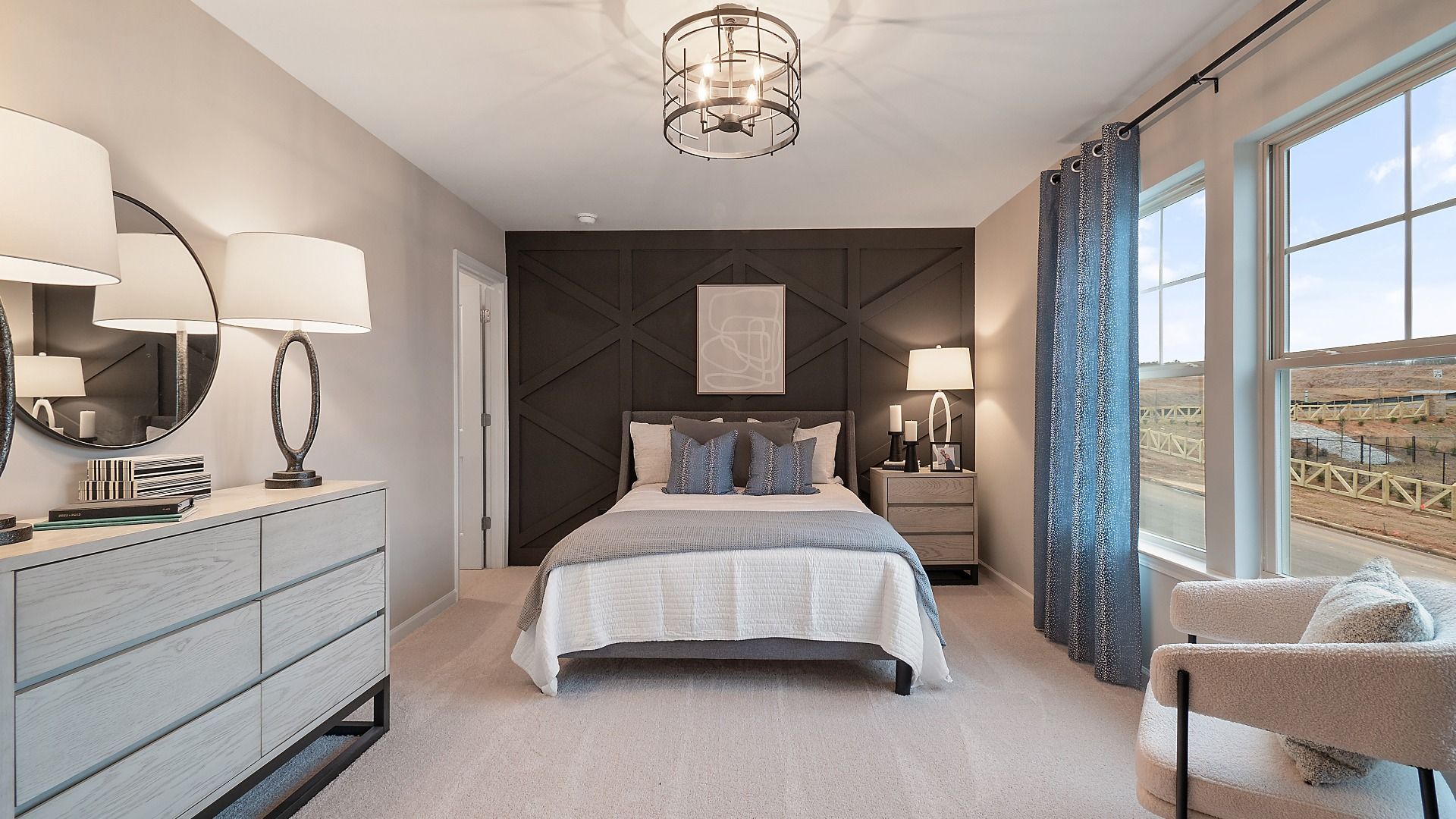 Zoey II secondary bedroom with large windows and carpet flooring in new construction single family home at Abbotts Crossing.
