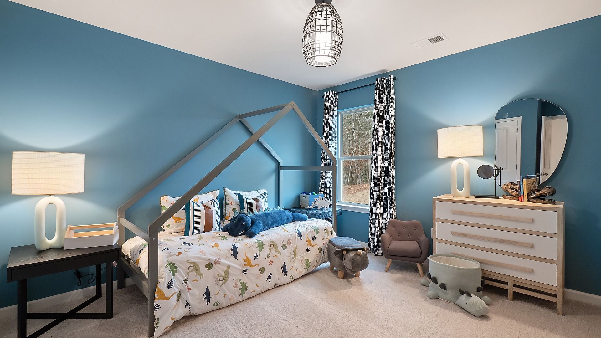 Secondary bedroom with natural light and carpet flooring in the Zoey II plan at Abbotts Crossing in Conyers, GA