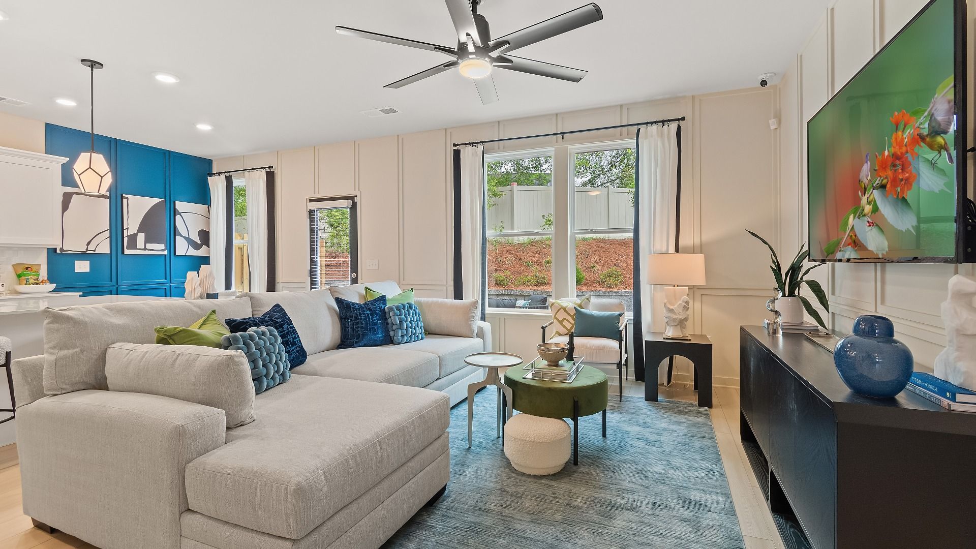 Open family room with natural light in new construction townhome at Avery Landing in McDonough, GA