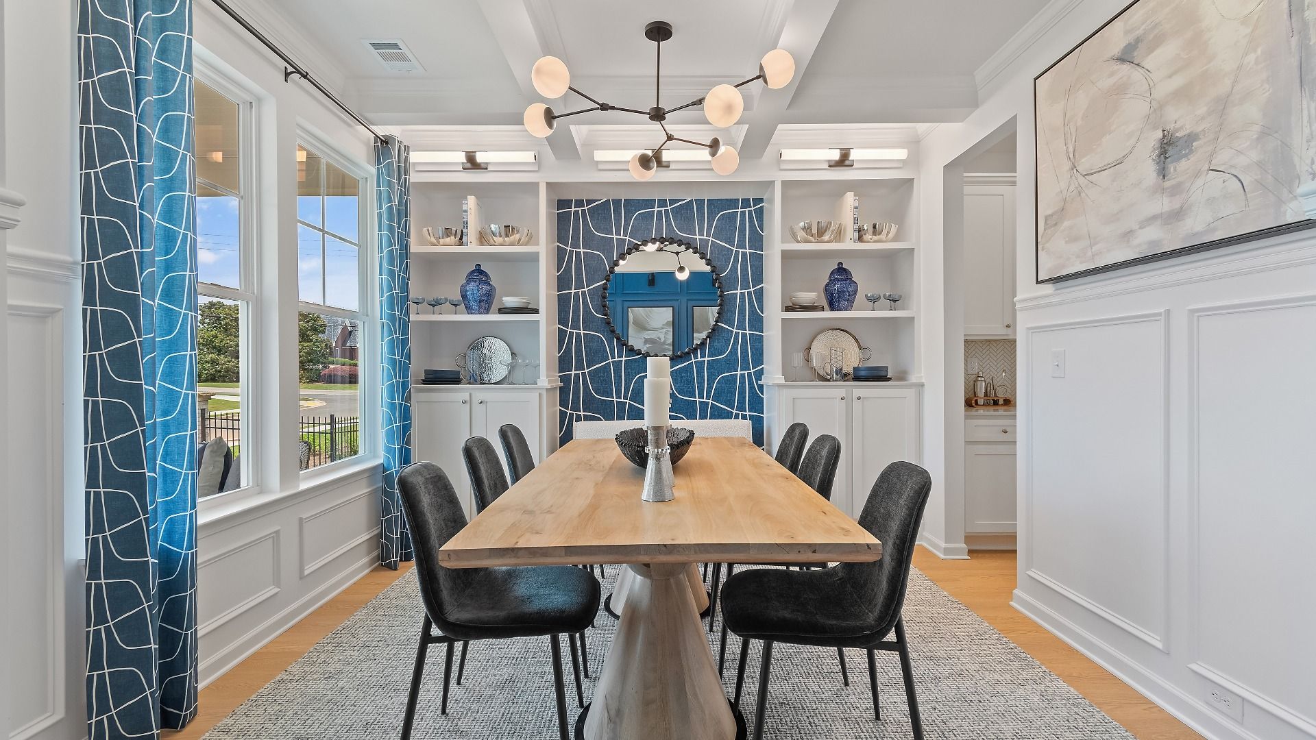 Dining room with coffered ceiling and natural light at Grandview at Millers Mill in Stockbridge, GA.