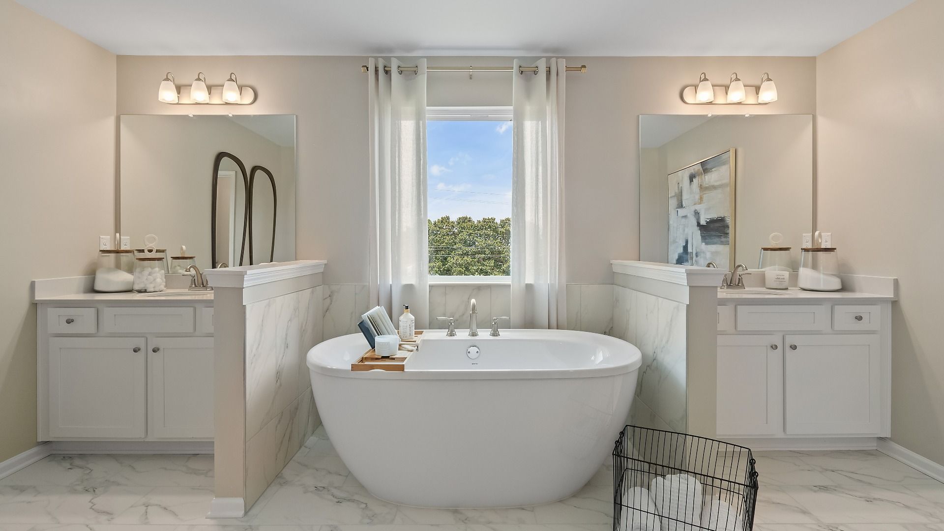 Elegant primary bath with dual vanities and soaking tub at Grandview at Millers Mill in Stockbridge, GA.