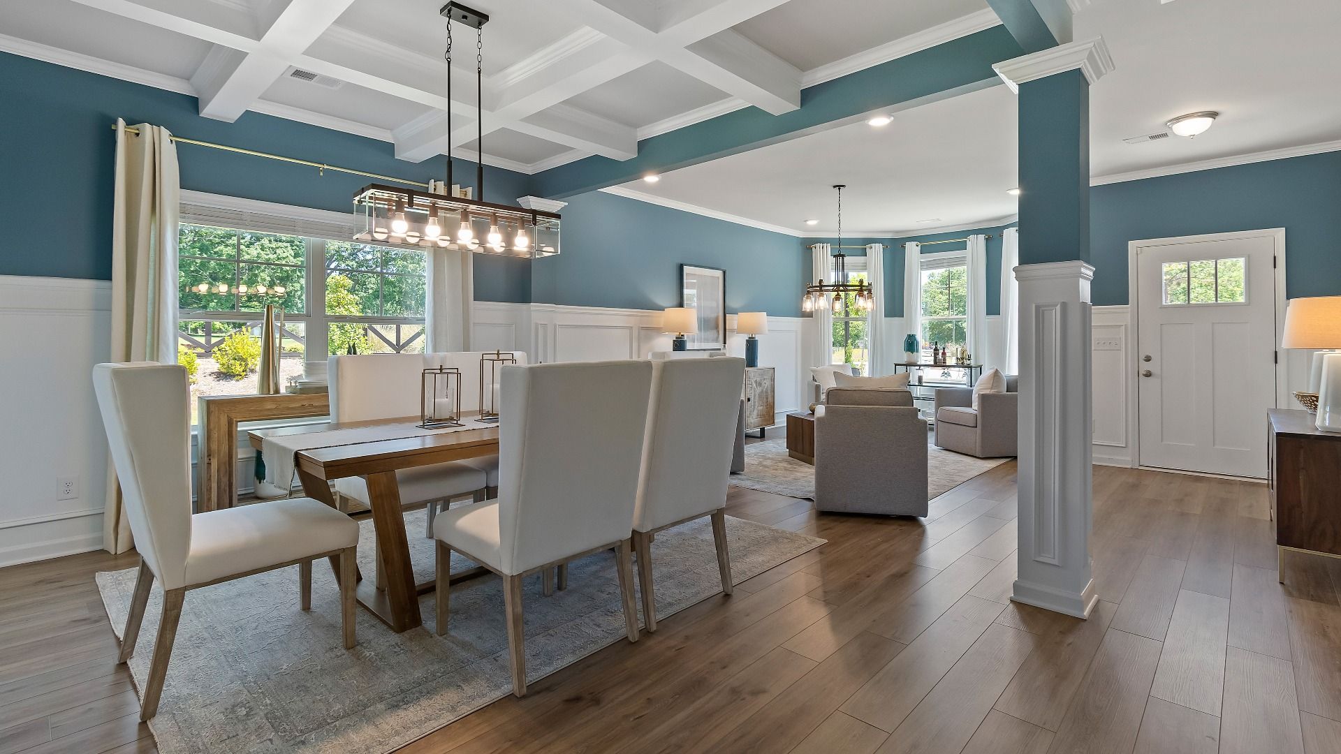 Open-concept first-floor with LVP flooring, natural light, and contemporary design in the Everest III at Berkeley Lakes.