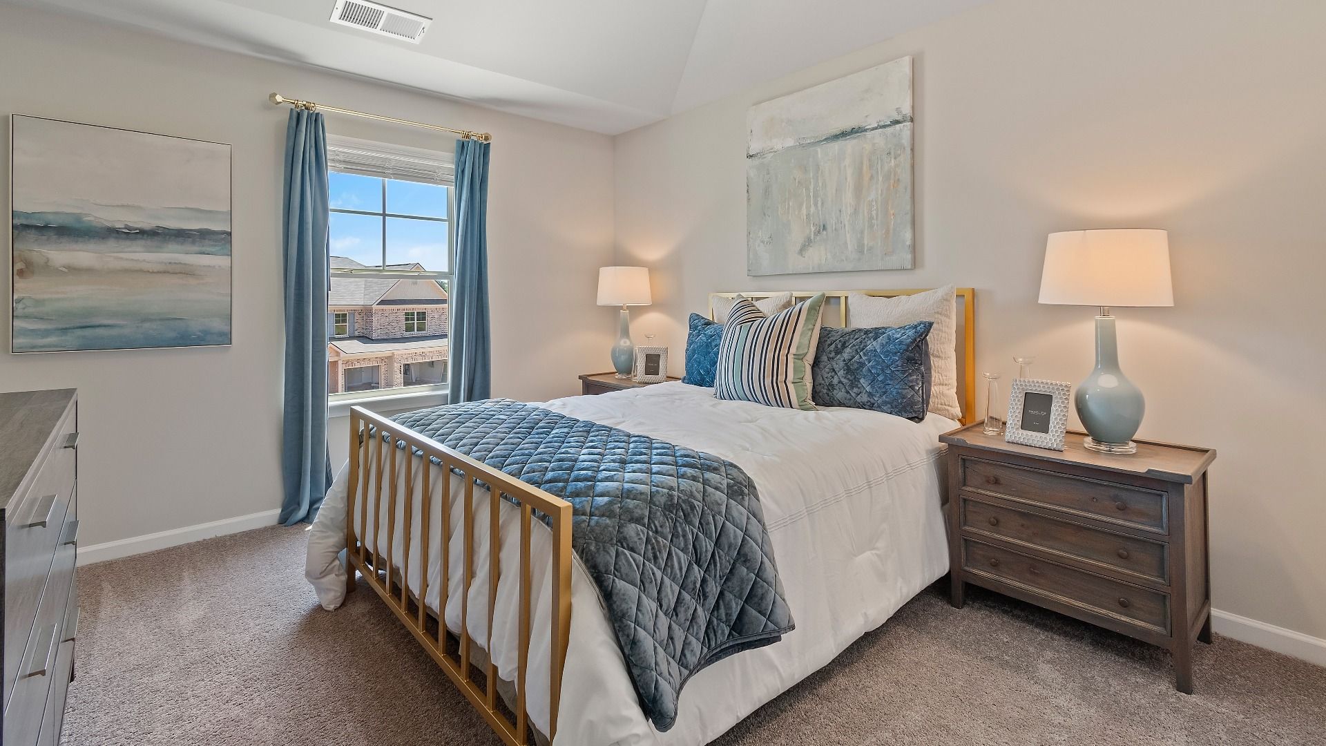 Secondary bedroom with carpet flooring and window for natural light in the Everest III at Berkeley Lakes in Locust Grove, GA.