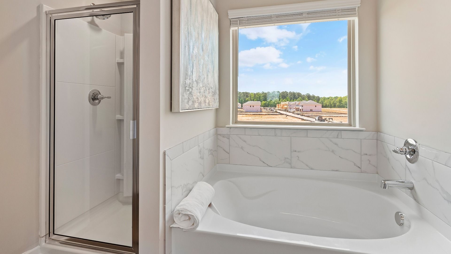Primary bath with walk-in shower, standalone tub, and modern tile detail in the Everest III at Berkeley Lakes.