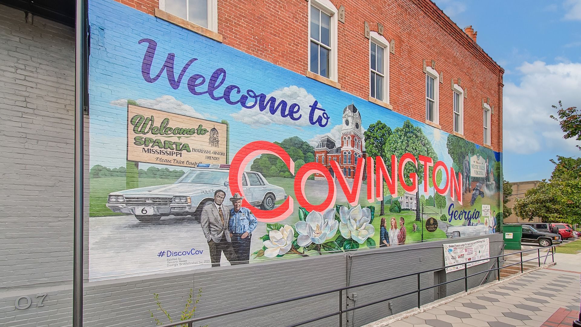 Welcome to Covington sign on feature wall near Westminster in Covington, GA.