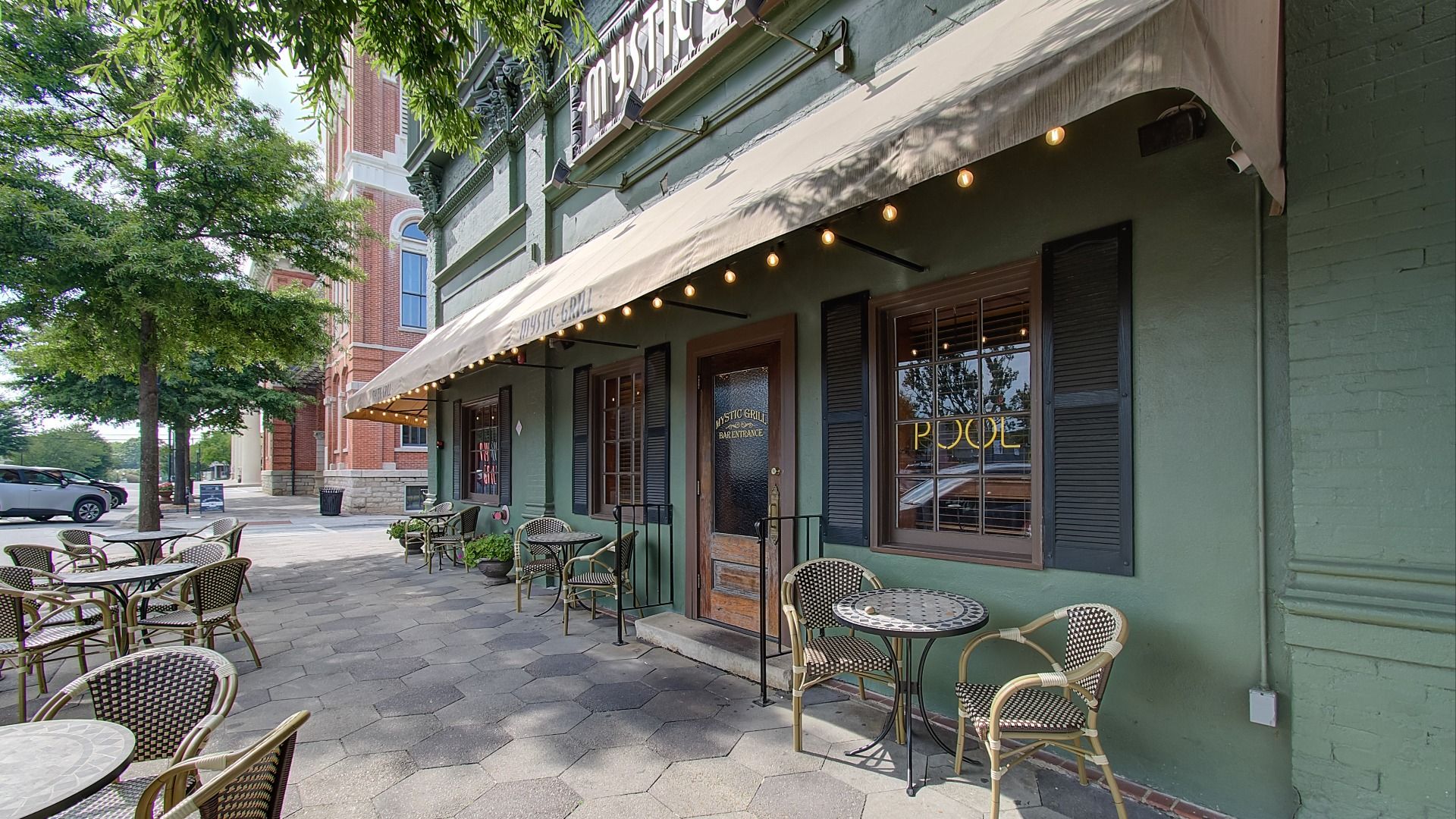 Mystic Grill restaurant with outdoor seating in downtown Covington, GA near Westminster community.