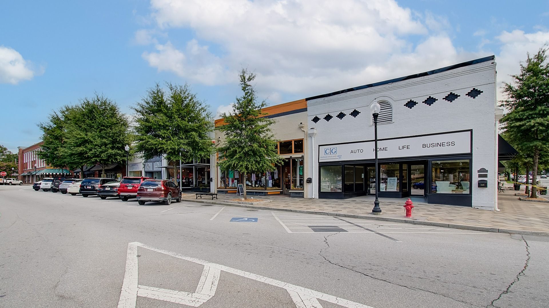 Walkable downtown strip in Covington, GA featuring various stores near Westminster community.