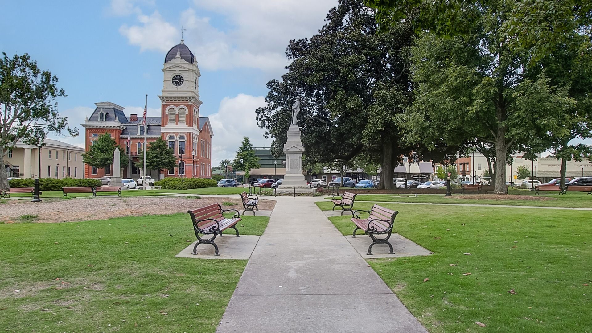 Historic monument and bench seating in downtown Covington, GA near Westminster community.