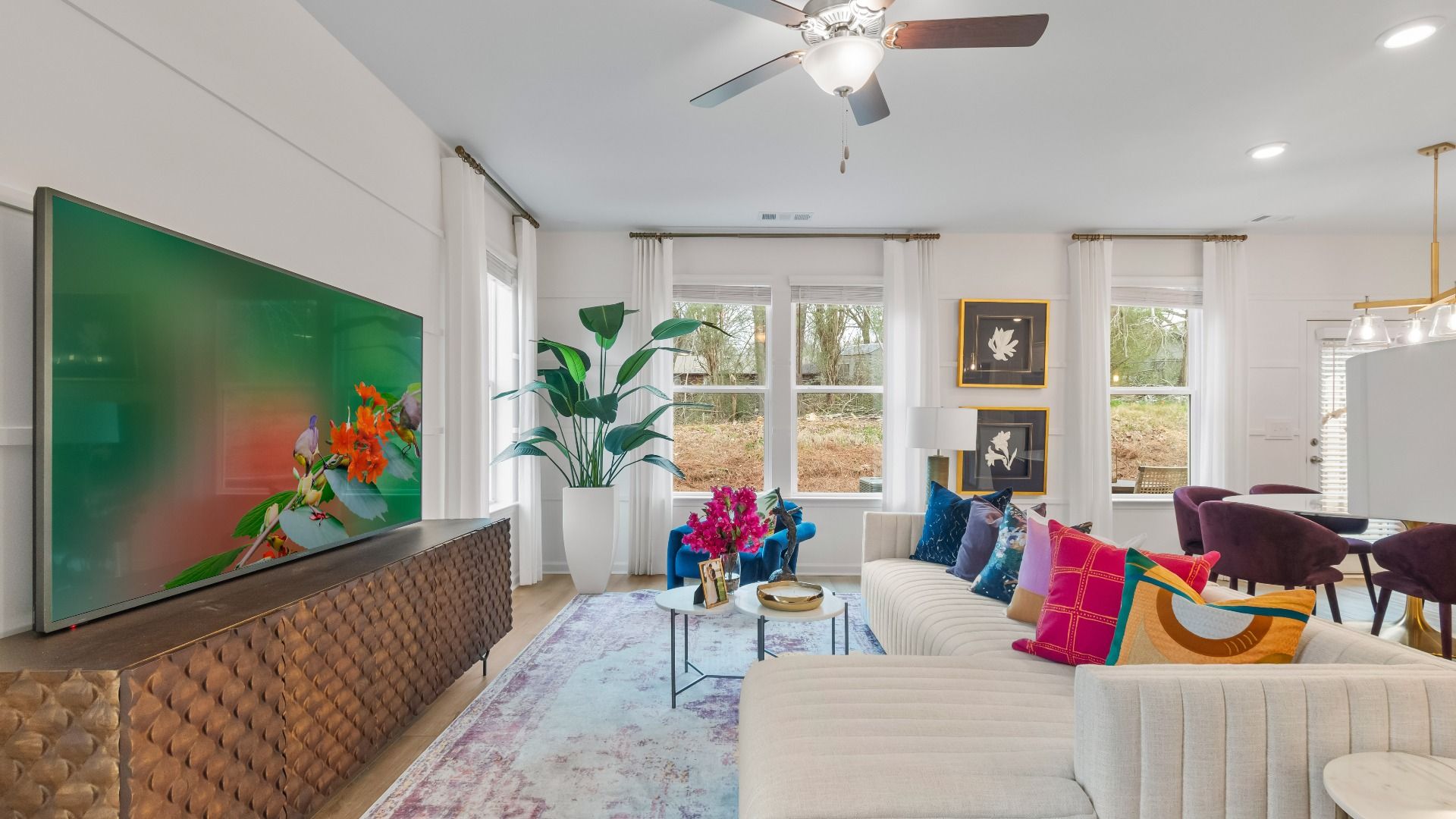 Open family room with large windows for abundant natural light and neutral modern finishes in Diamante in Stockbridge, GA.