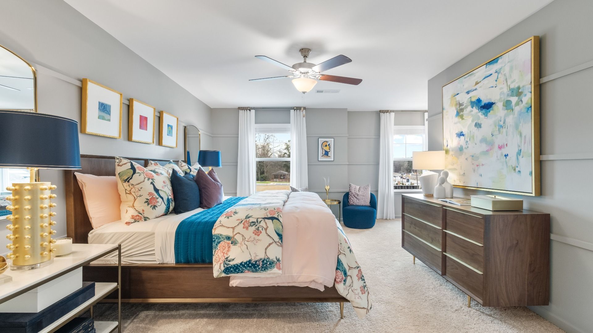 Spacious primary suite with large windows, neutral finishes, and modern design in new construction townhome in Diamante.