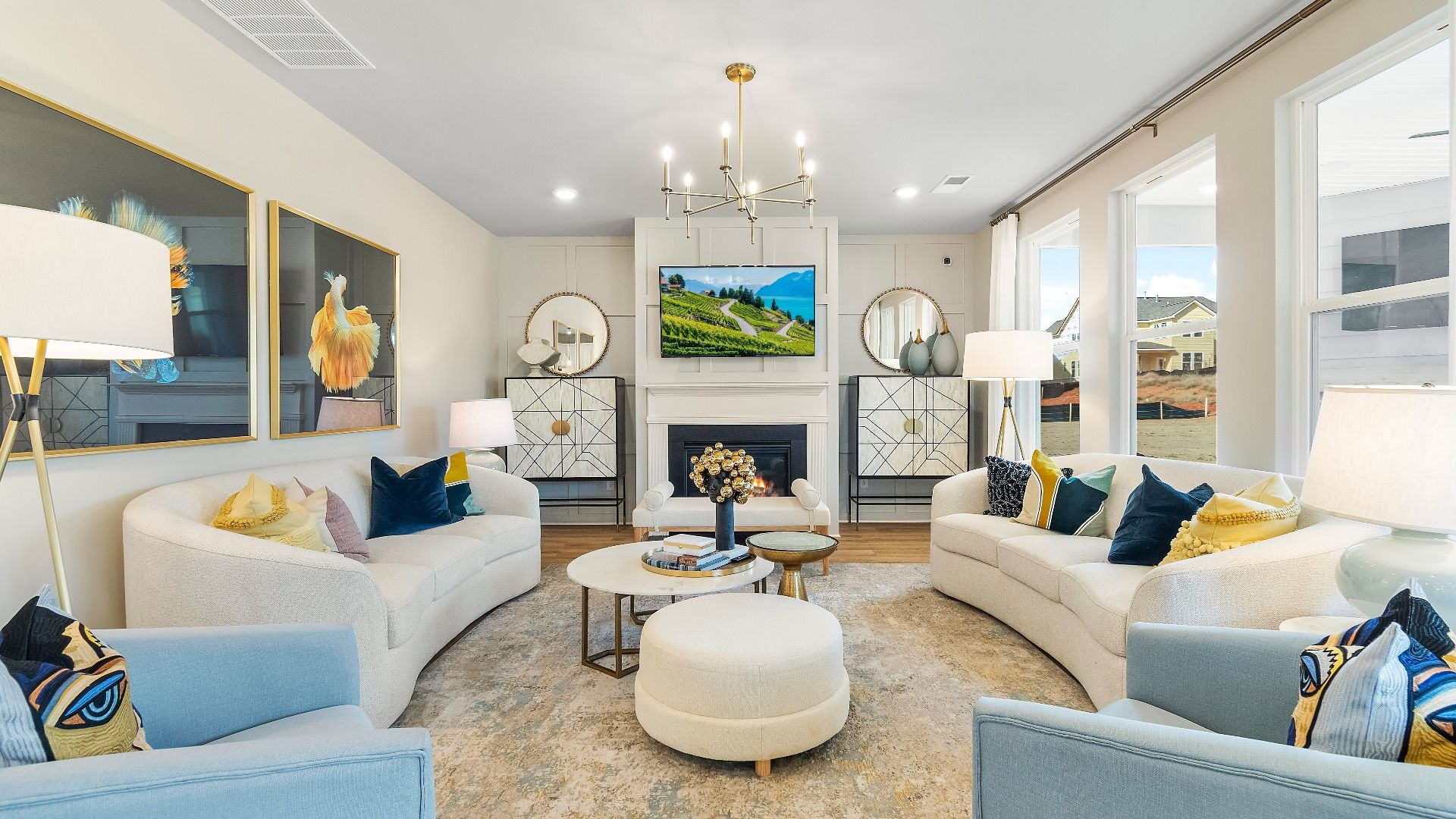 Spacious family room with center gas fireplace, modern finishes, and abundant natural light at Cooper Park, McDonough, GA.