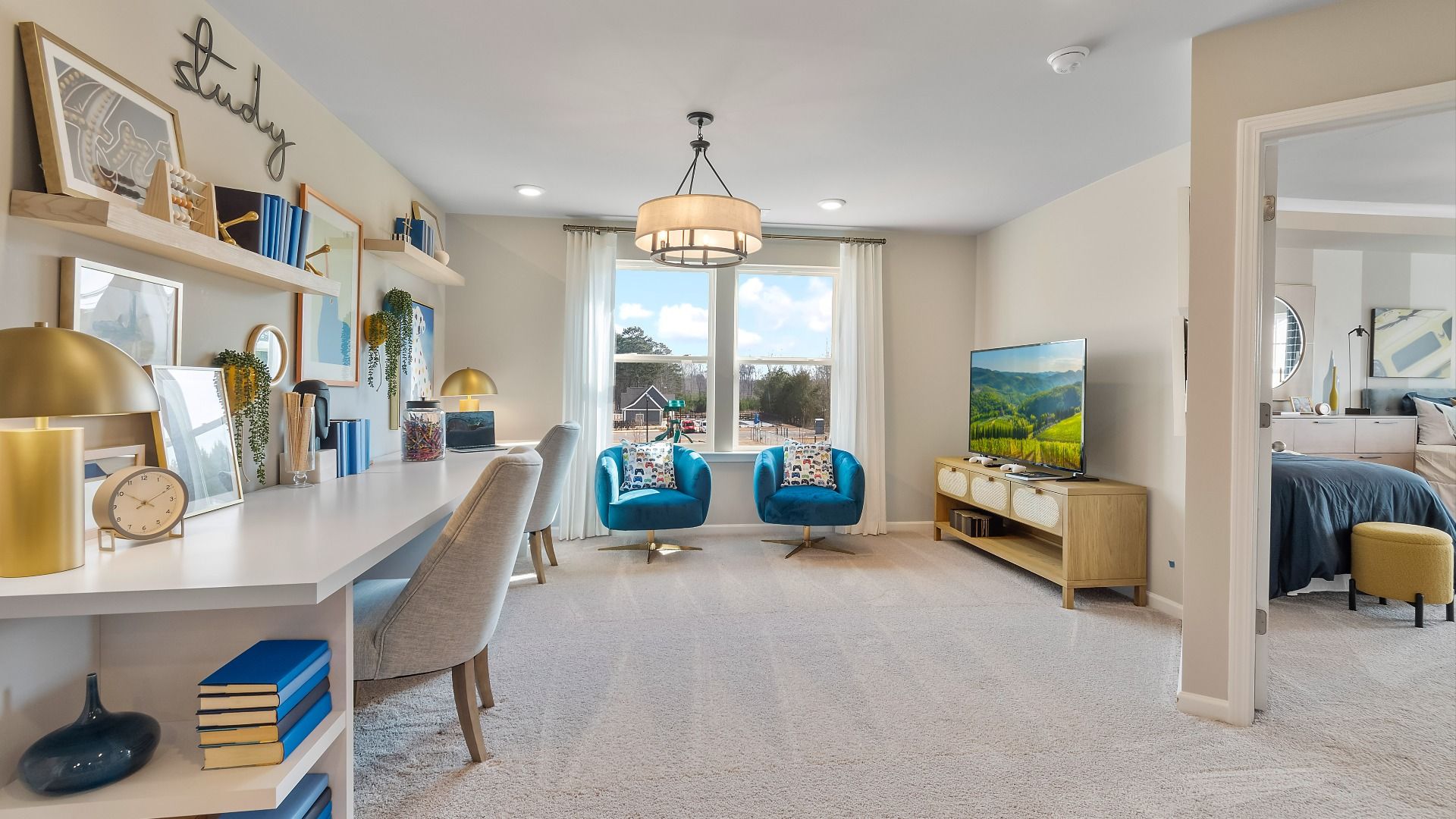 Open loft space with large window for flexible use of study or lounge space at Cooper Park in McDonough, GA.
