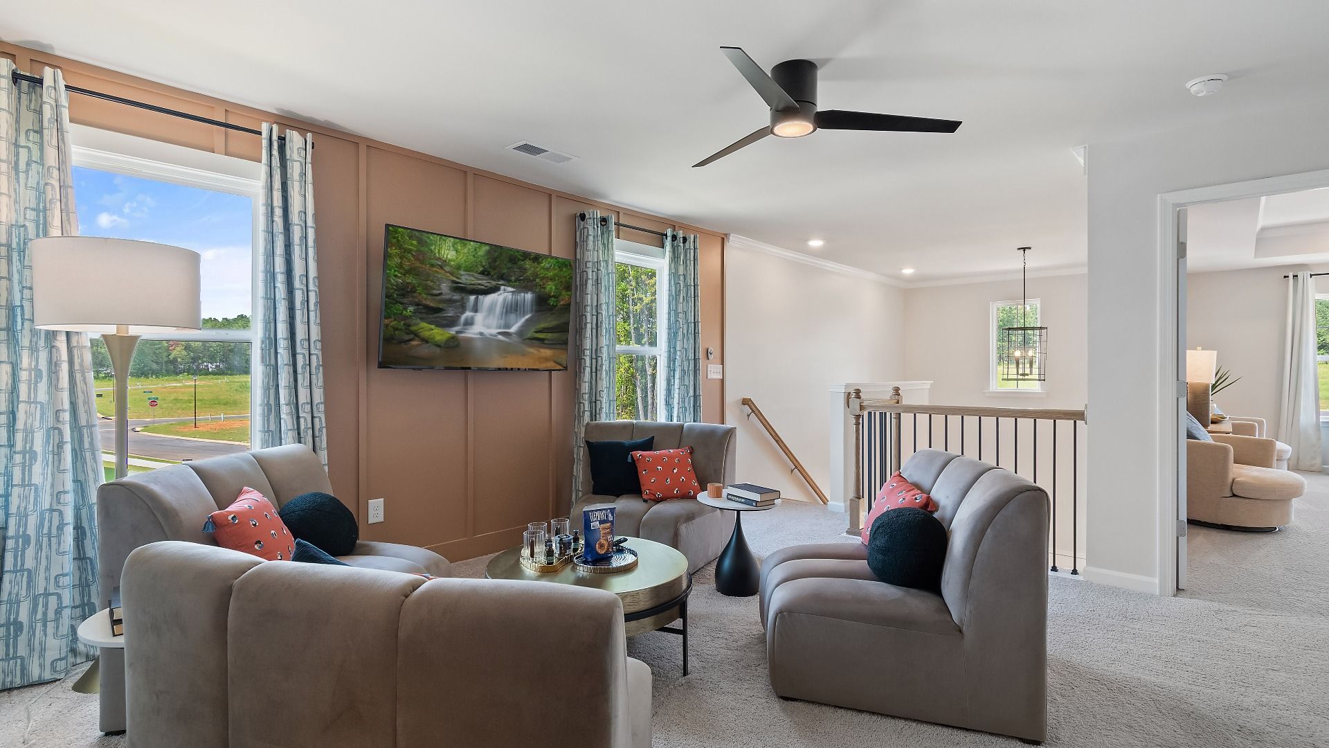 Millhaven spacious loft for flexible work and living area use with carpet flooring at Abbotts Crossing in Conyers, GA.