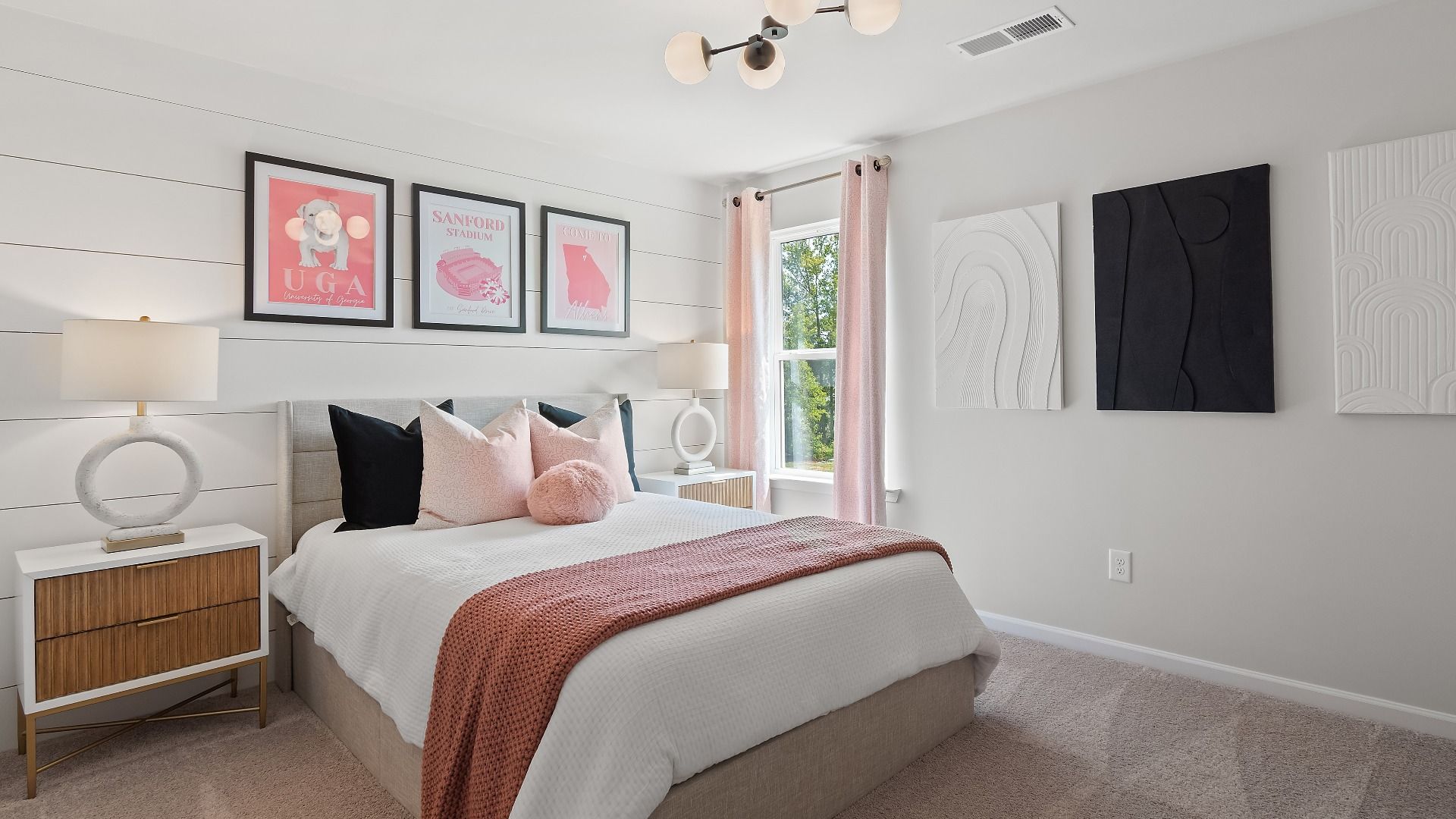 Secondary bedroom in Millhaven plan featuring carpet flooring, natural light, and neutral modern details at Abbotts Crossing.