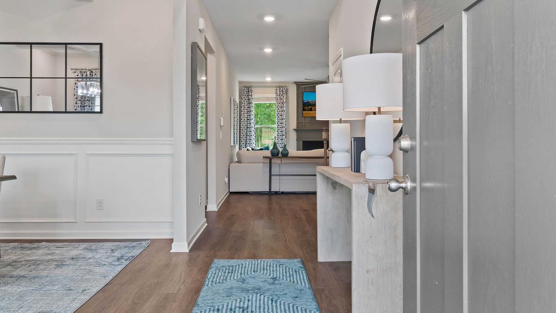 Open entry with LVP flooring and modern design in the Clarity at Adagio in Dacula, GA.
