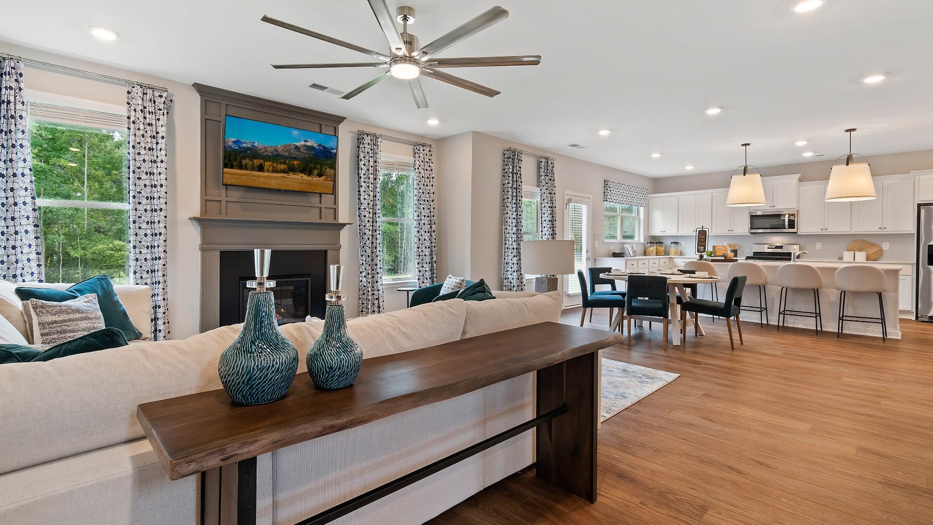 Open-concept first floor with spacious family room flowing into the breakfast area and kitchen in the Isabella II at Adagio.