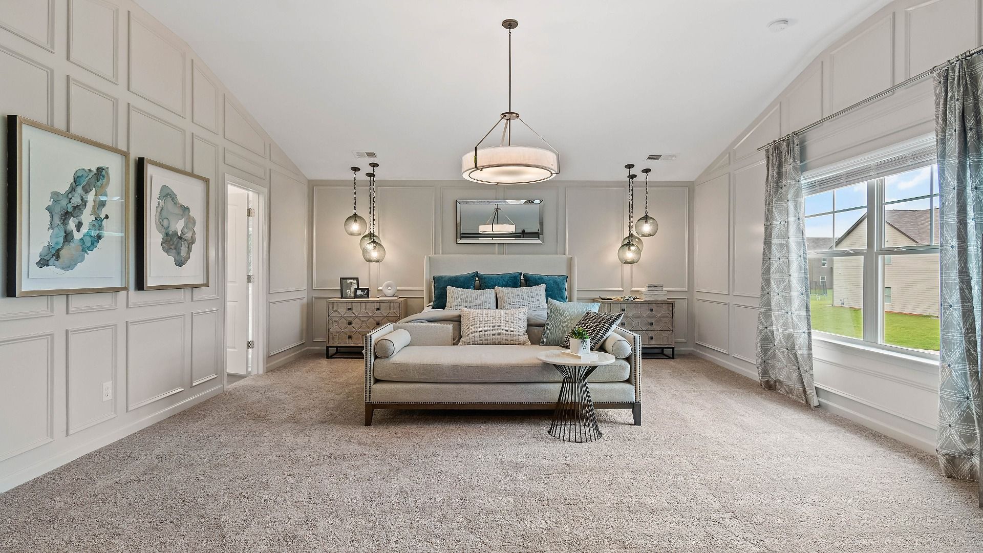 Spacious primary suite with carpet flooring, natural light, and neutral modern finishes in the Isabella II at Adagio.