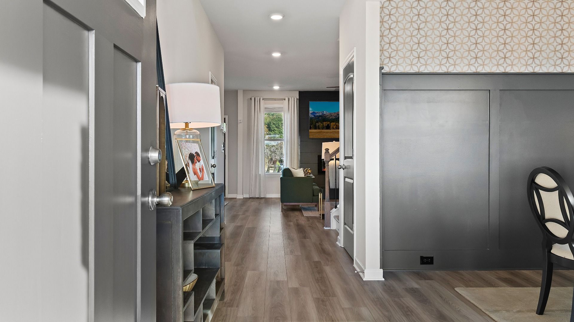 Bright entryway with high ceilings, decorative trim, and modern finishes in new construction home at Adagio in Dacula, GA.