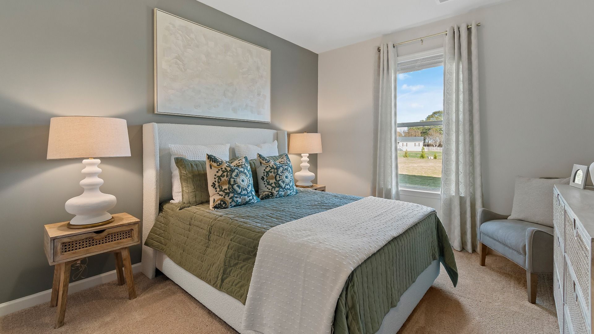 Spacious secondary bedroom with bright window and contemporary décor in Adagio new construction home in Dacula, Georgia.