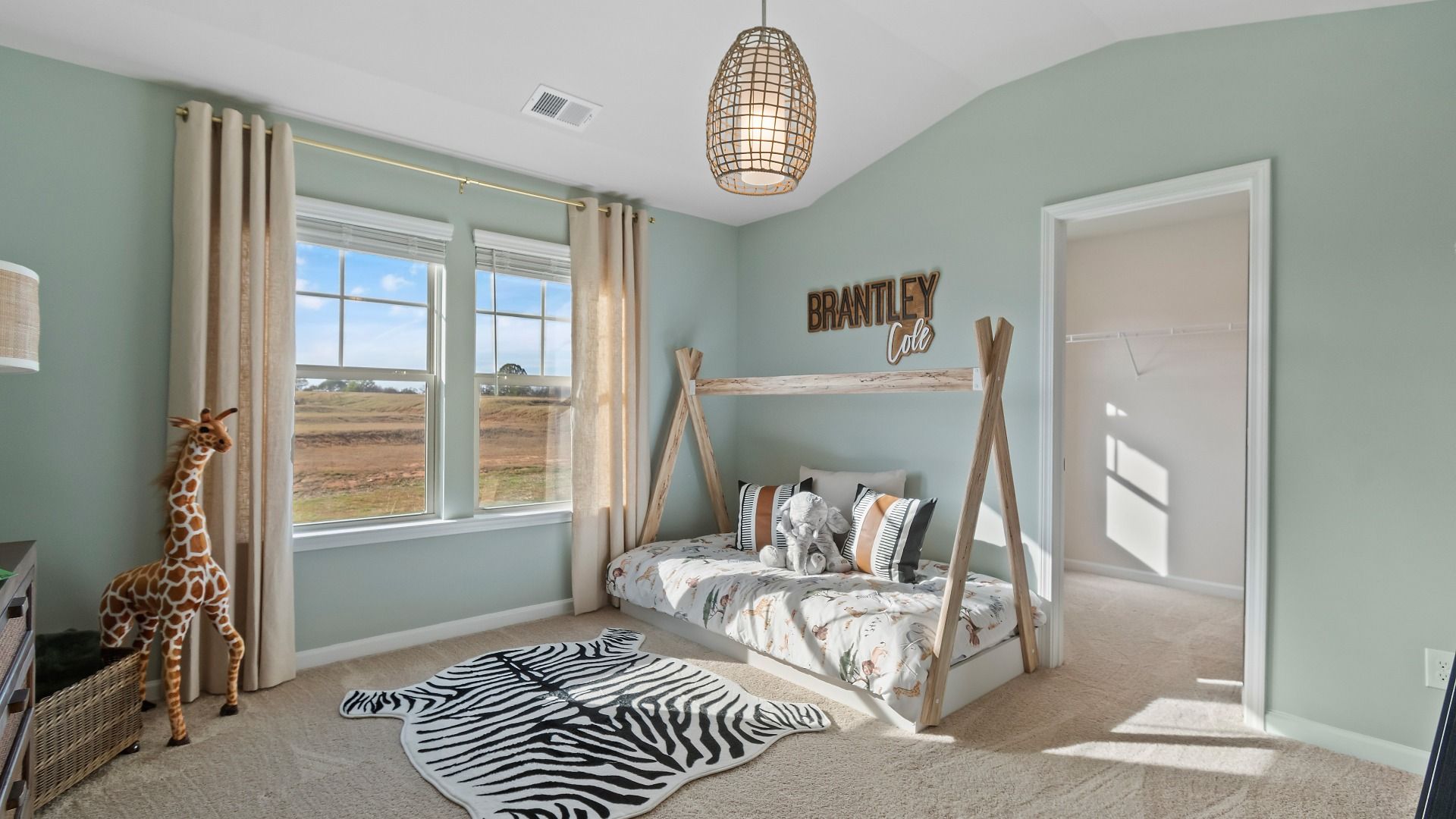 Inviting bedroom with neutral palette and abundant natural light in Abigail II home at Adagio community in Dacula, GA.