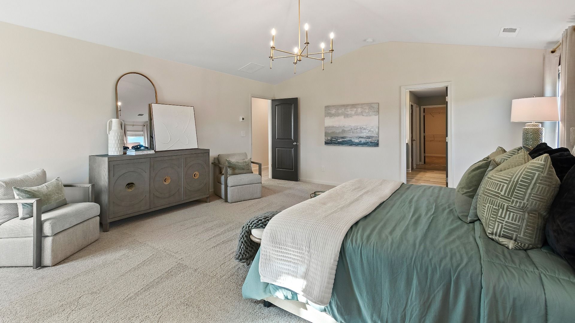 Spacious primary suite with large windows, neutral décor, and abundant natural light in new construction home in Dacula, GA.