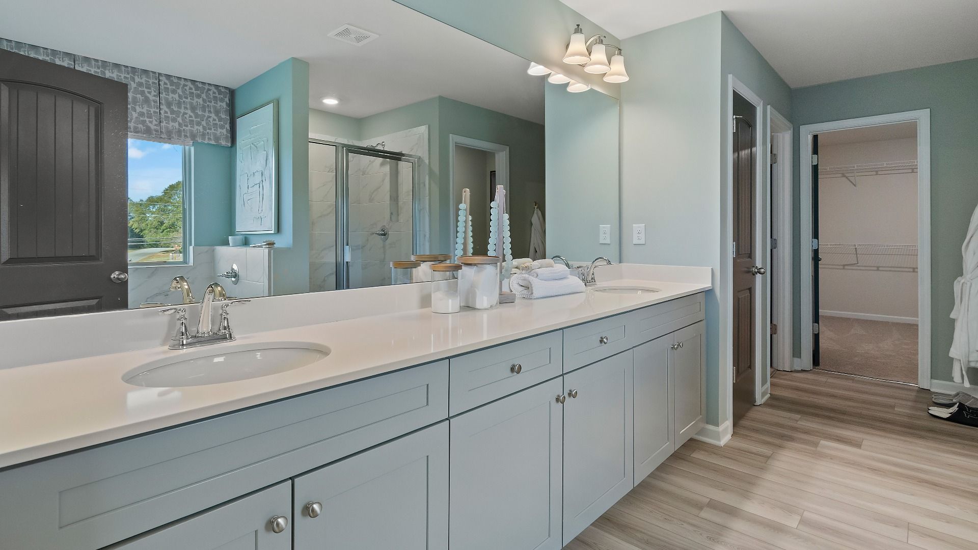 Luxury primary bathroom with double vanity in new construction home at Adagio in Dacula, Georgia.