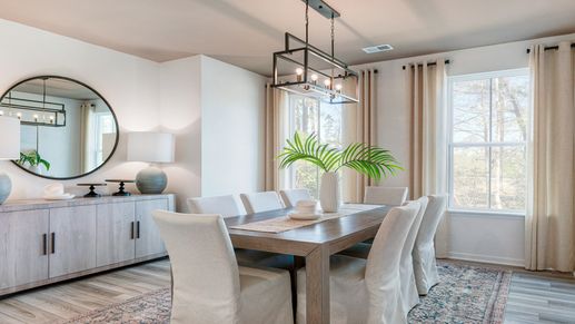 Dining-Area in Bluffs at Sun Colony in by DRB homes offering white walls and big open windows