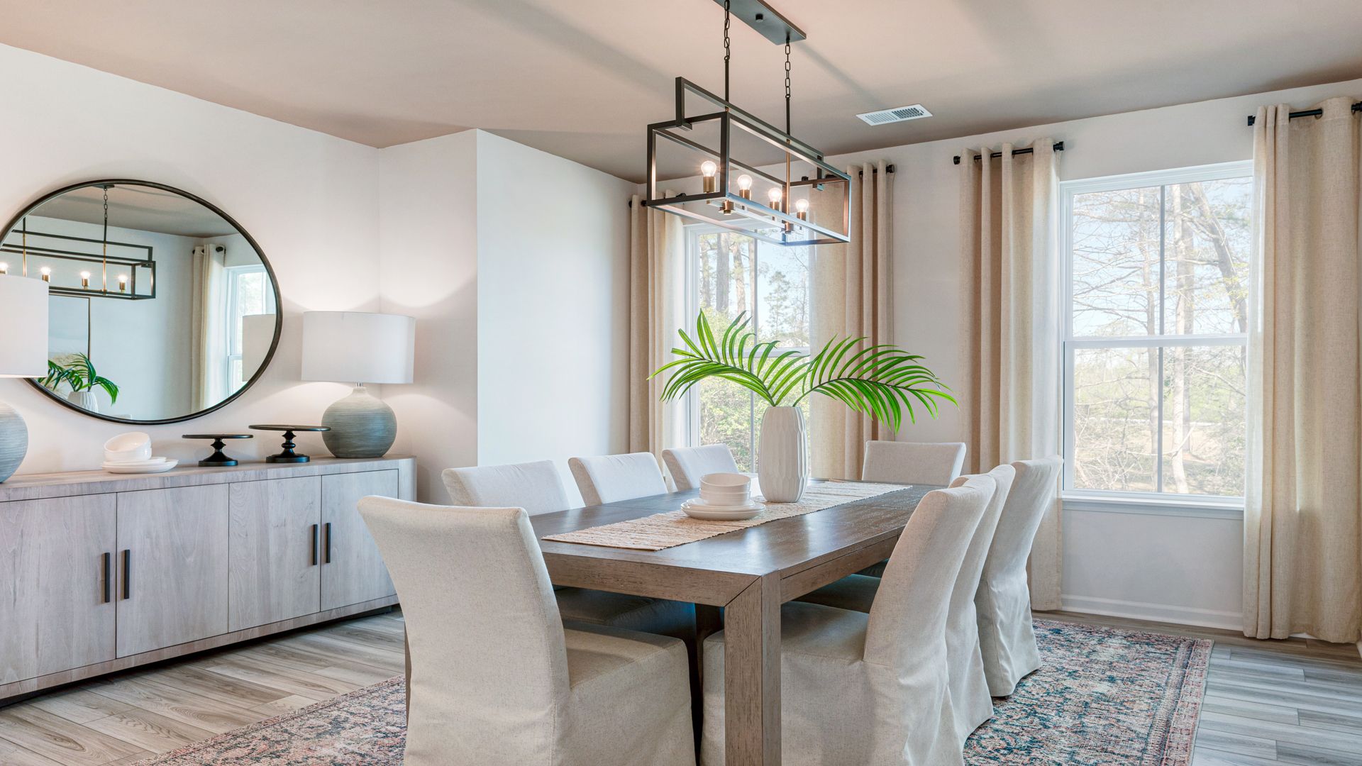 Dining-Area in Bluffs at Sun Colony in by DRB homes offering white walls and big open windows