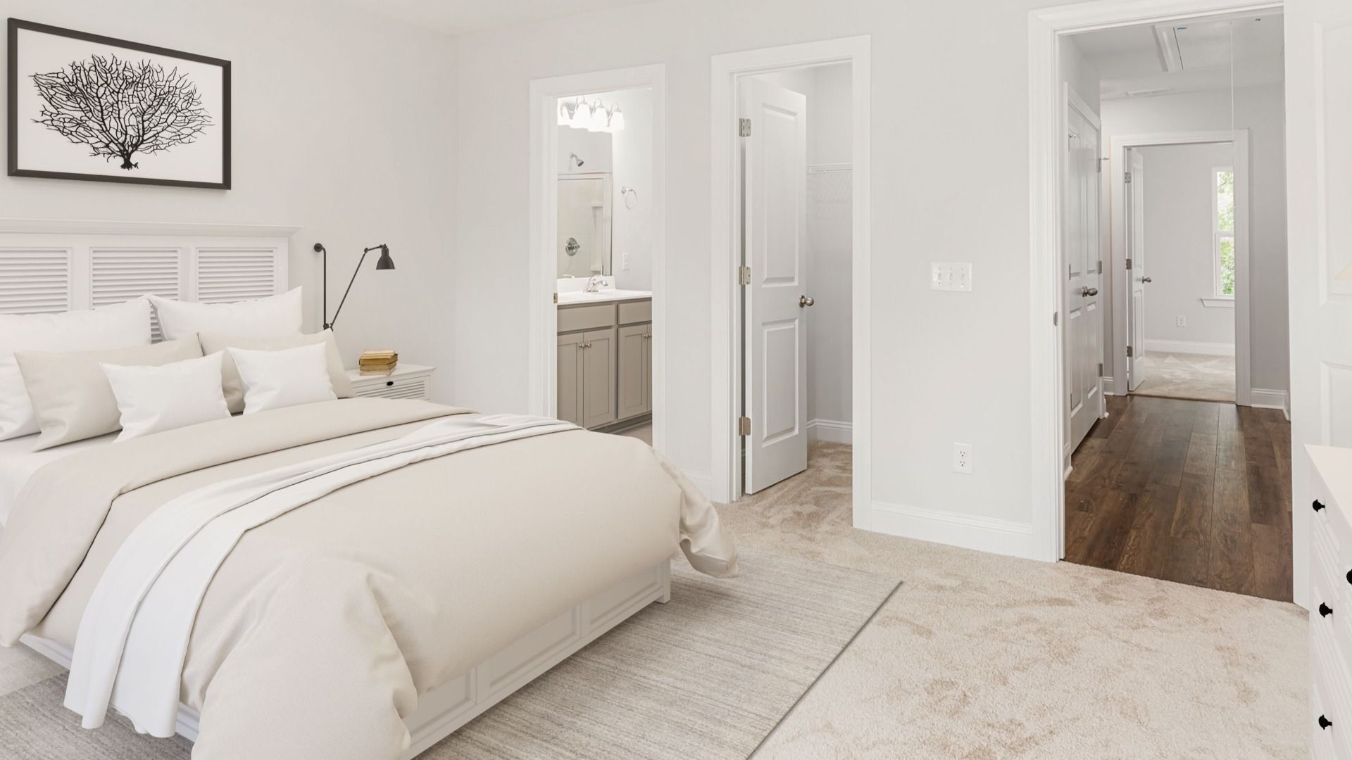 Owner's suite with walk-in closet & en suite bathroom in a DRB Homes Brookgreen model home at Park Circle Station.