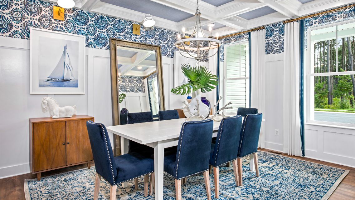 Dining room with 2 large windows and coffered ceiling in a DRB Homes St. Kitts Model Home.
