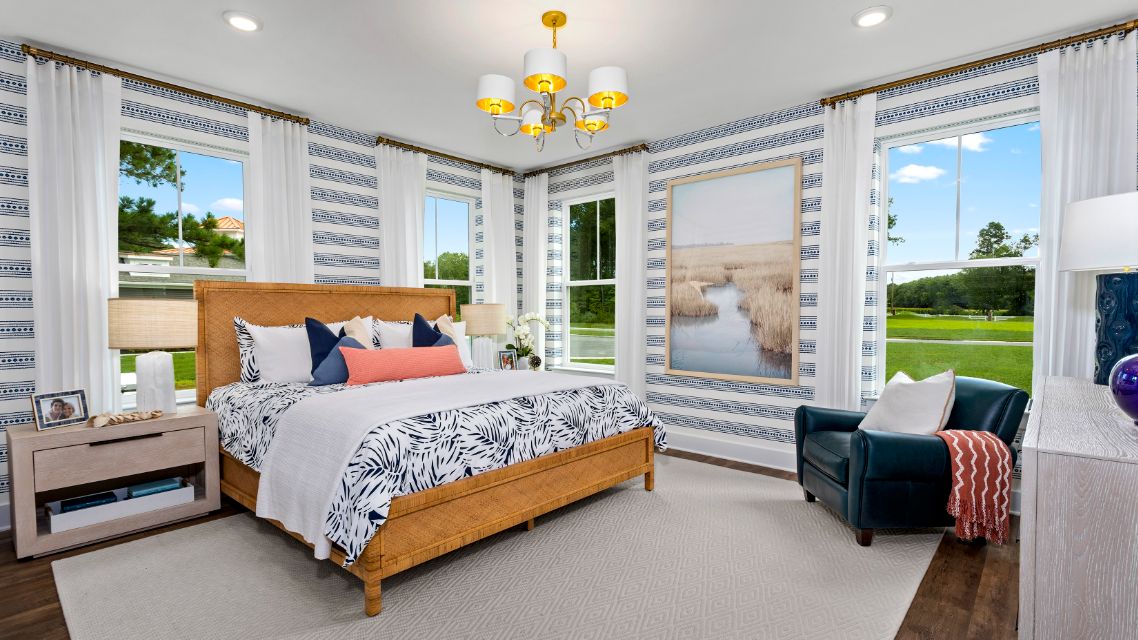Owner's suite with two large windows on adjacent walls in a DRB Homes St. Kitts Model Home.