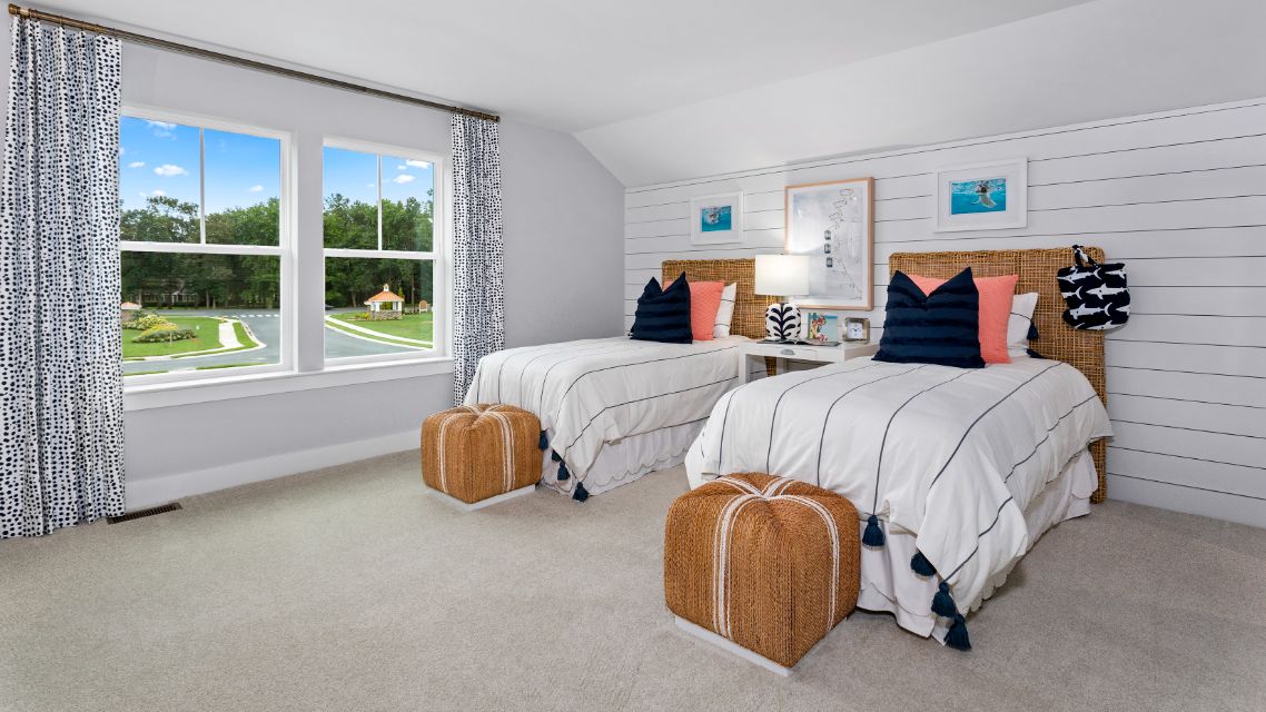 Secondary bedroom with large double window in a DRB Homes St. Kitts Model Home.