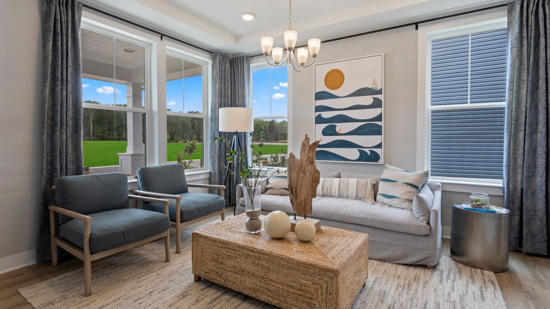 Flex room used as a living room with four large windows on adjacent walls in a DRB Homes St. John Model Home.