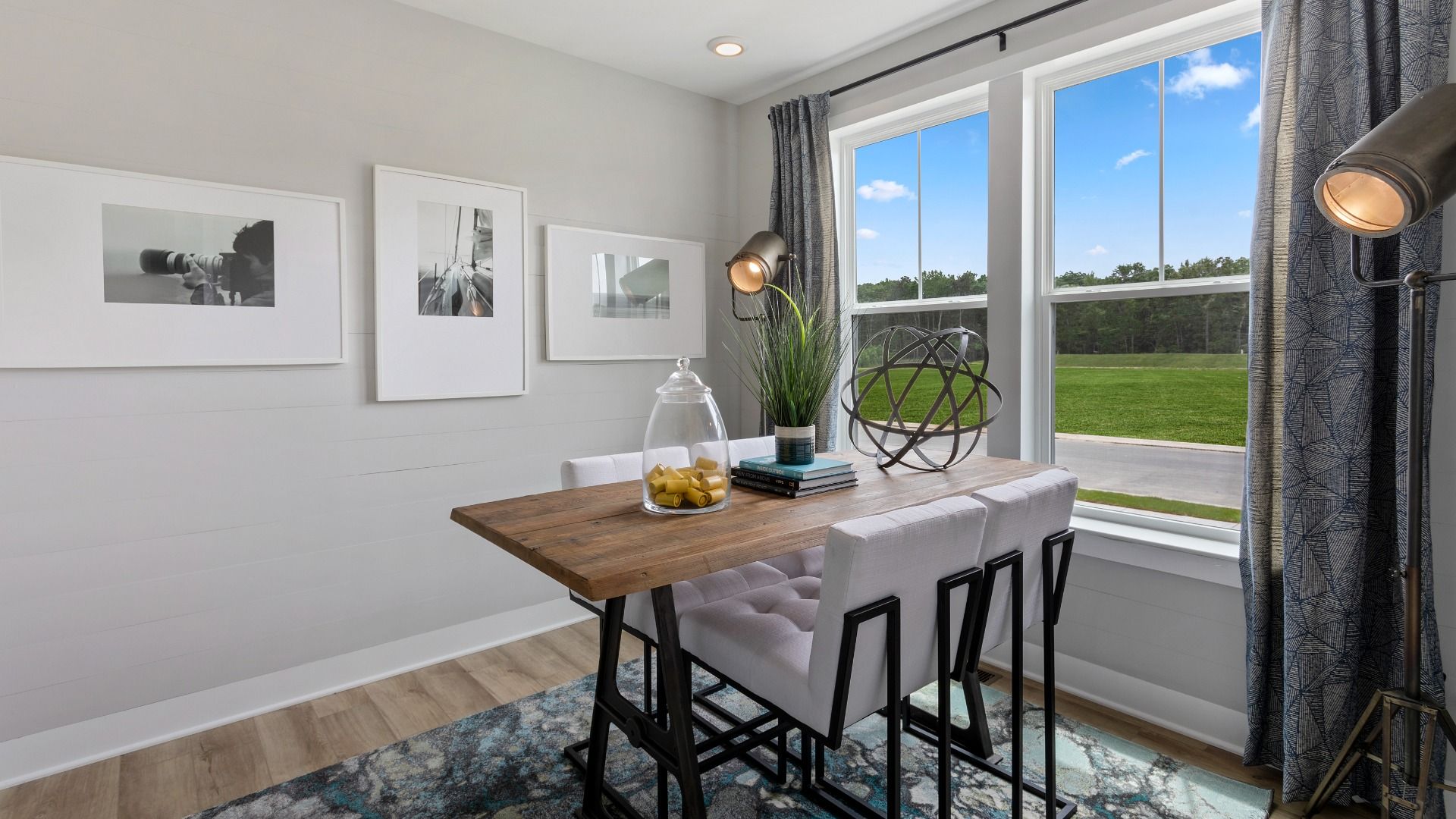 Dining room with large double window in a DRB Homes St. John Model Home.