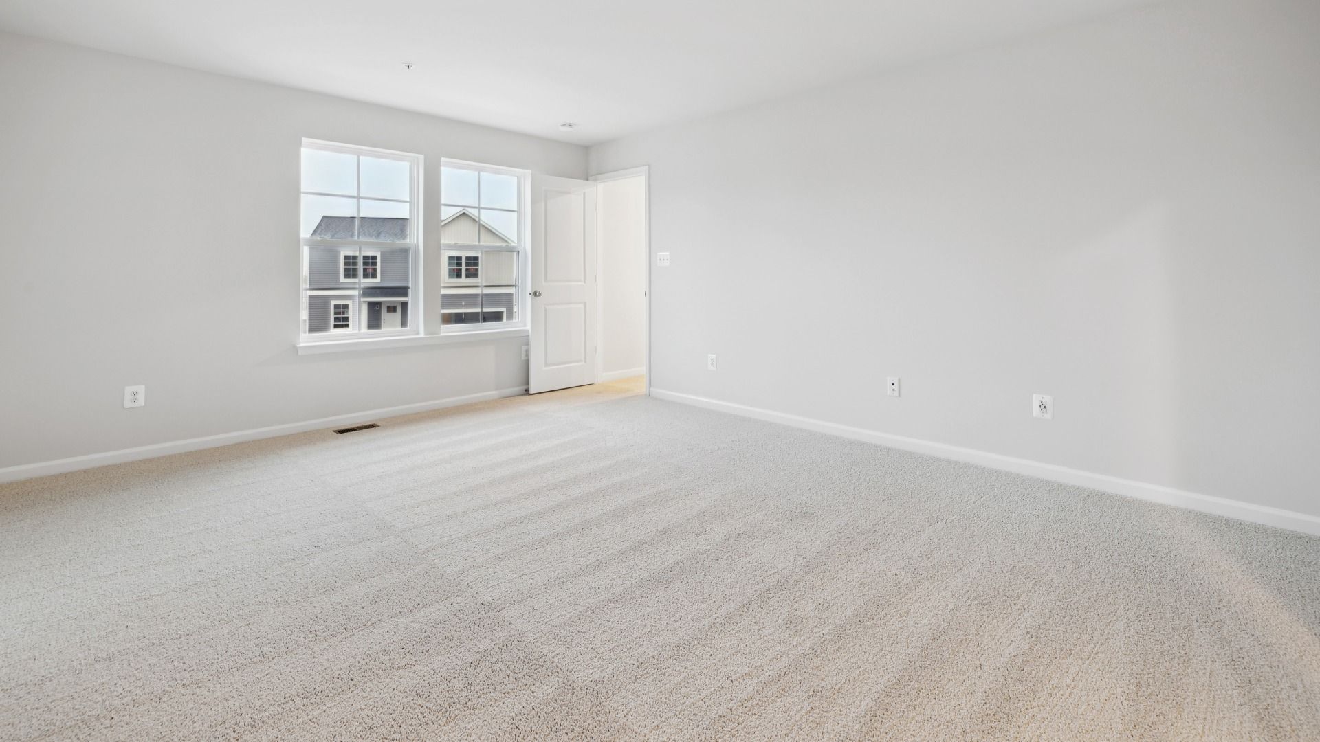 Sunlit Owner's Suite with a Private Bathroom in the Whitehall at The Village of College Park by DRB Homes.