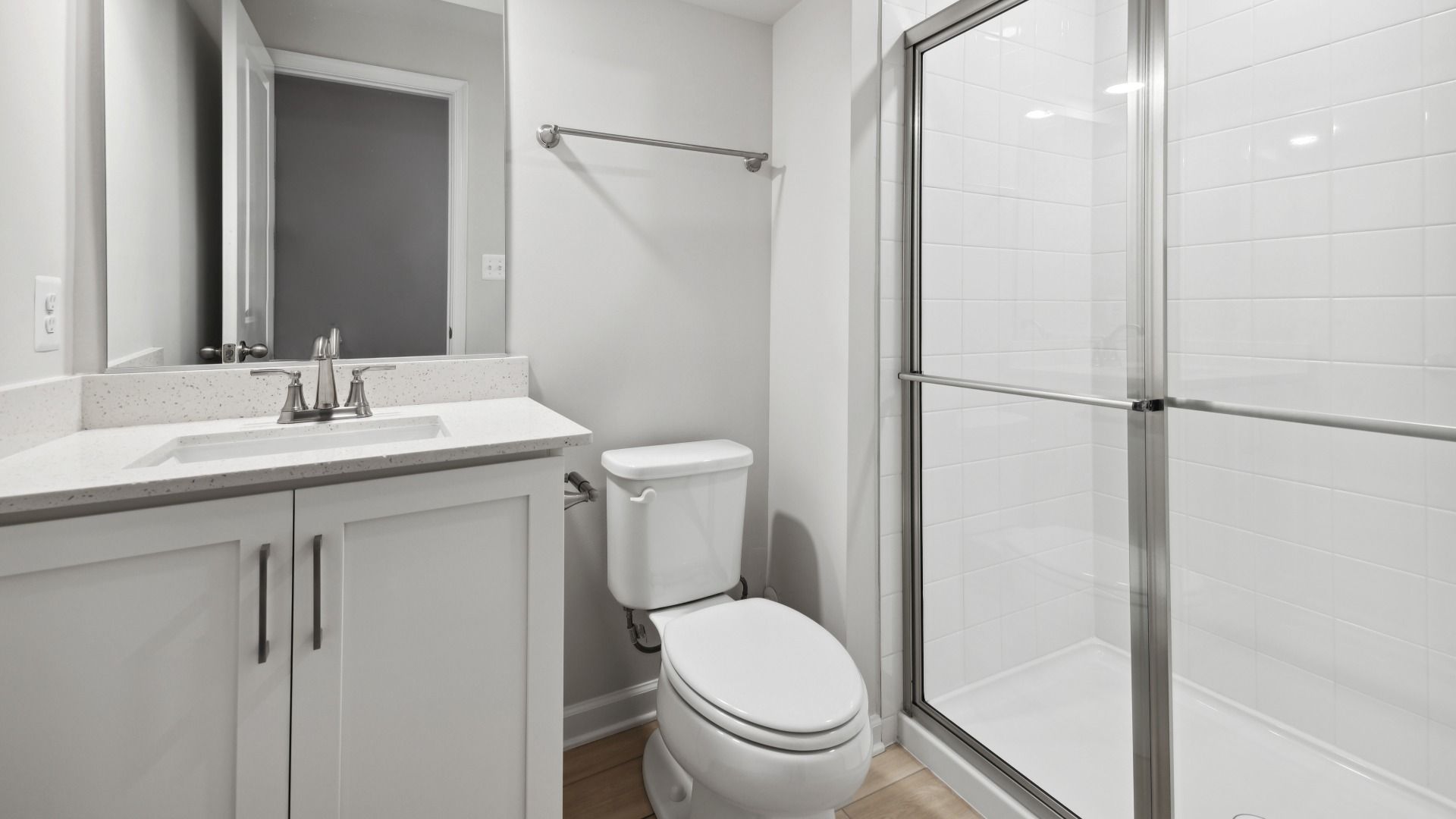 Full Bathroom in the Finished Basement in the Whitehall at The Village of College Park by DRB Homes.