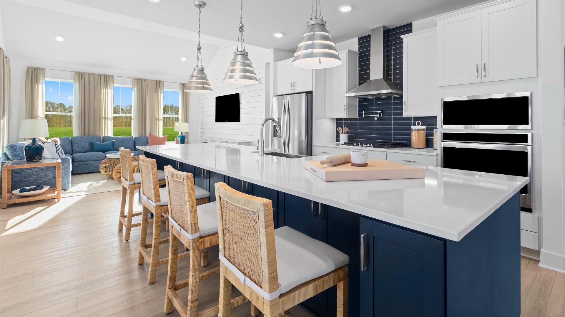 Island kitchen 2 toned Navy and white cabinets in the DRB Homes St. Kitts Model at the Wetherby community.