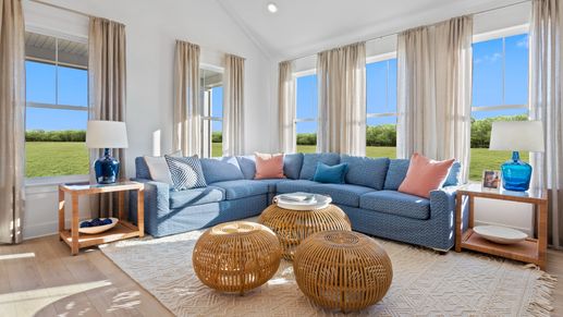 Family Room with vaulted ceiling and large windows in the DRB Homes St. Kitts Model at the Wetherby community.