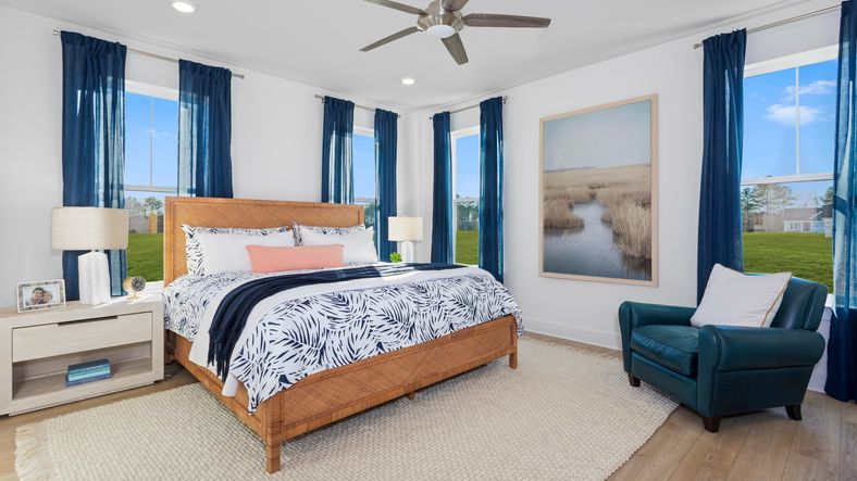 Primary suite with 2 walls of large windows in the DRB Homes St. Kitts Model at the Wetherby community.