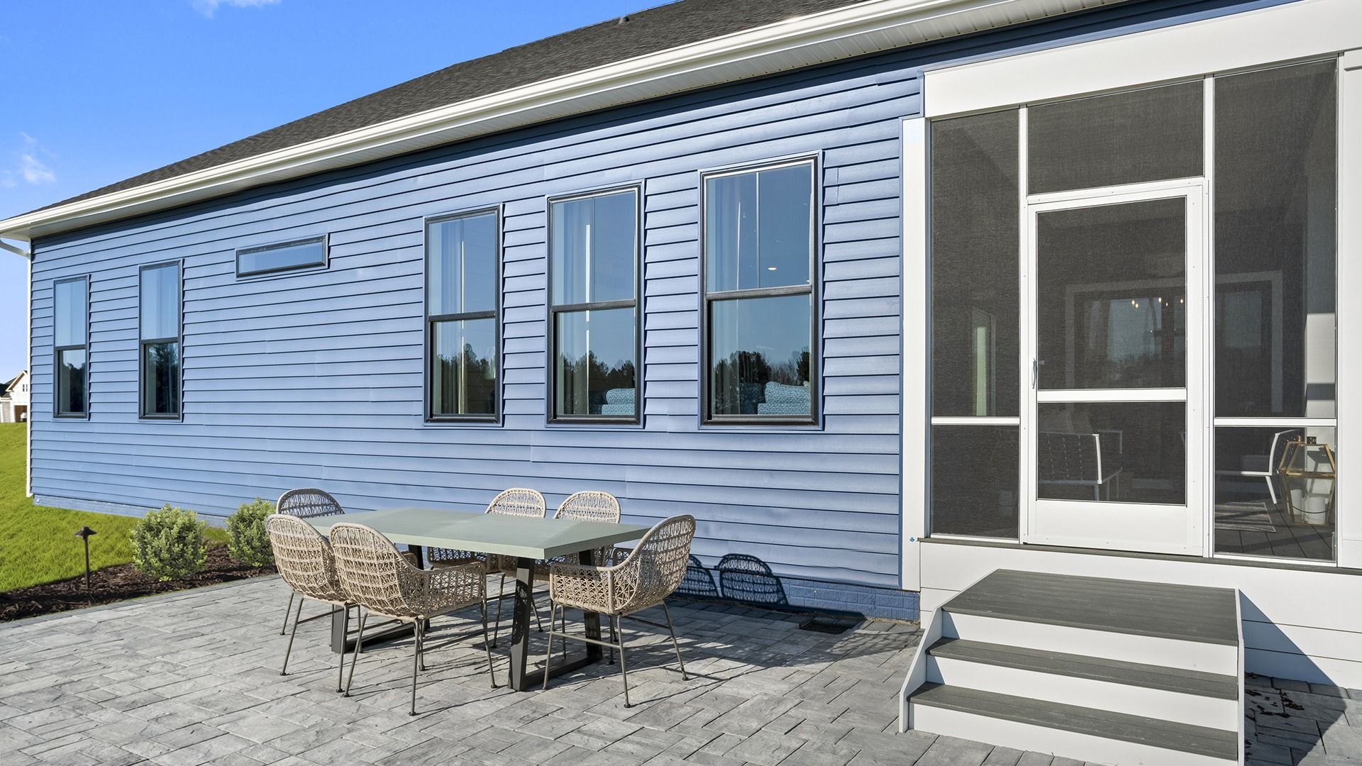 Bring Entertaining Outdoors with the Screened Lanai and Rear Patio in the St. Kitts model at Wetherby