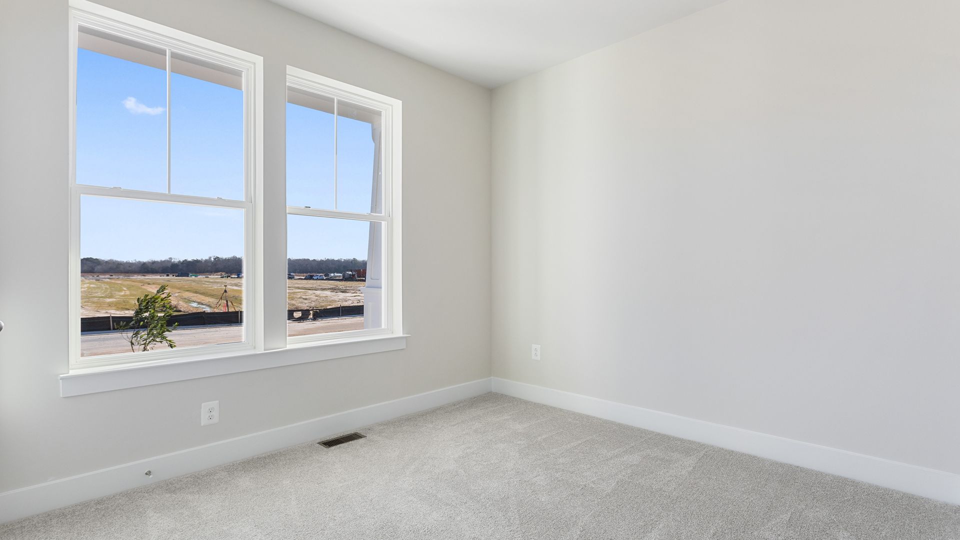 Sunlit Bedroom 2 in the Aloha at Wetherby in Millsboro, DE