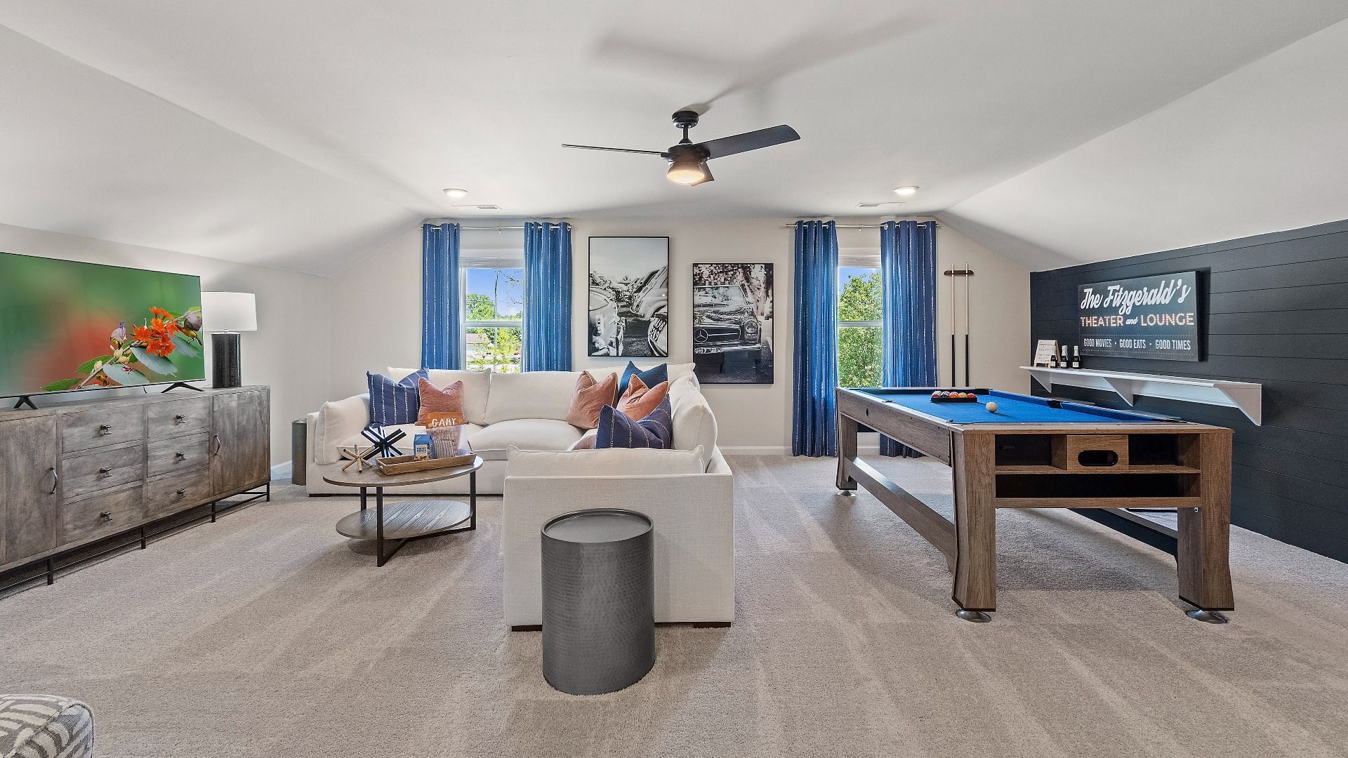 Flexible loft area with abundant natural light for lounge or playroom at Kingston in Locust Grove, GA.