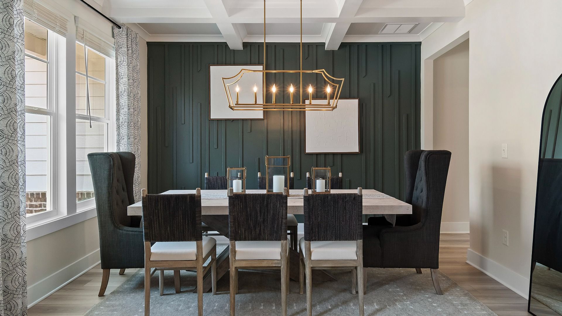 Bright dining room with elegant finishes and coffered ceiling at Saddleridge in Senoia, GA.