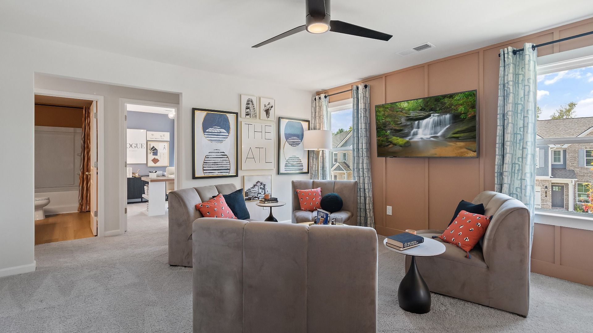 Flexible loft space off upstairs landing with carpet flooring and natural light at Westminster in Covington, GA.