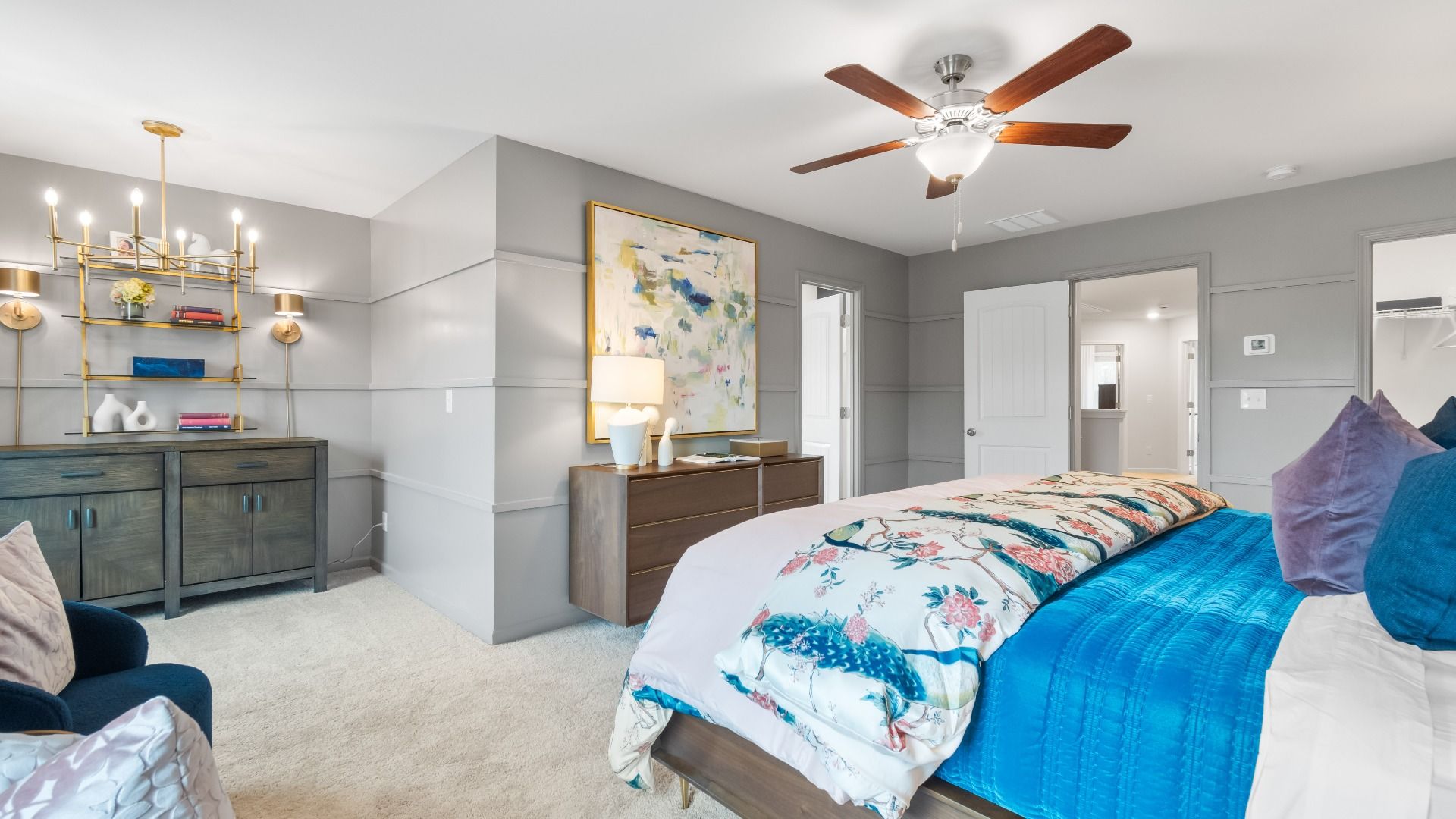 Spacious primary suite in a new construction Diamante townhome with neutral finishes, modern design, and sitting area space.
