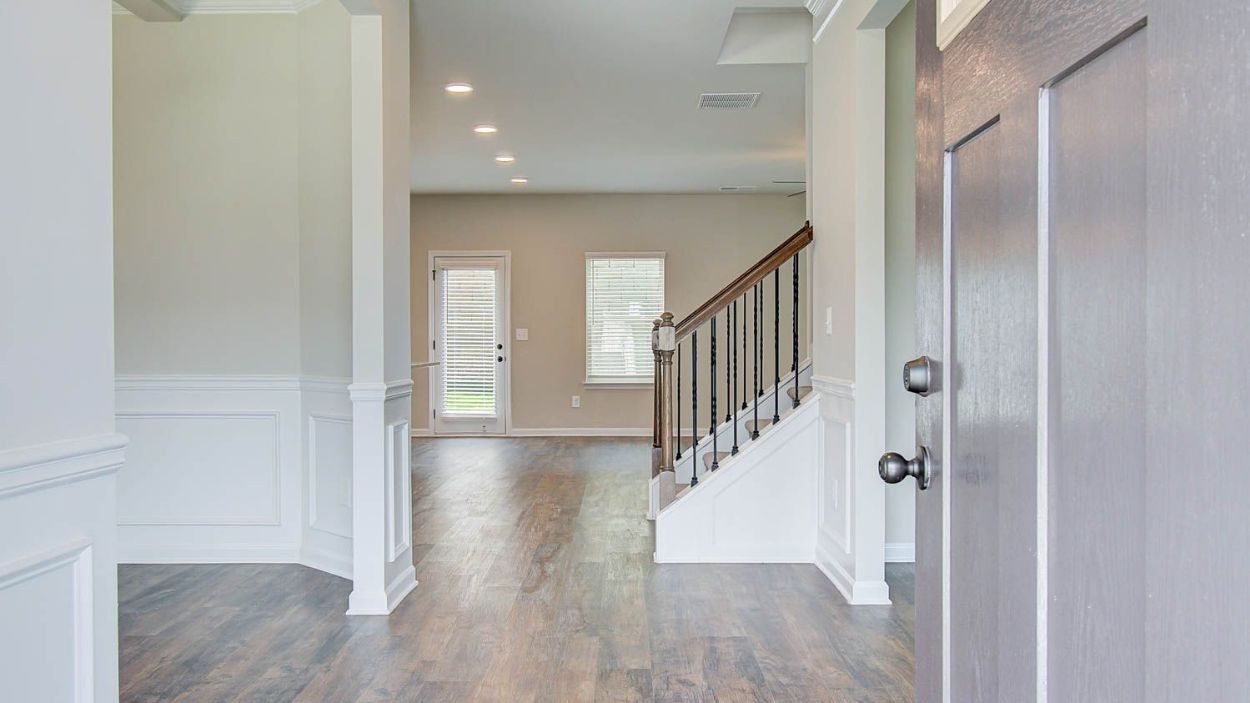 Vickery entry with view to dining room and open foyer at Berkeley Lakes in Locust Grove, GA.