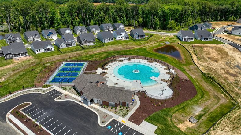 Pool, clubhouse  and tennis courts at the DRB Homes community of Chase Oaks in Lewes, Delaware.