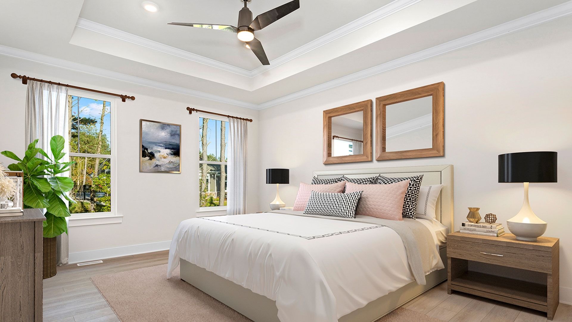 Owner's suite with tray ceiling and 2 large windows on one wall in DRB Homes Latitude home.
