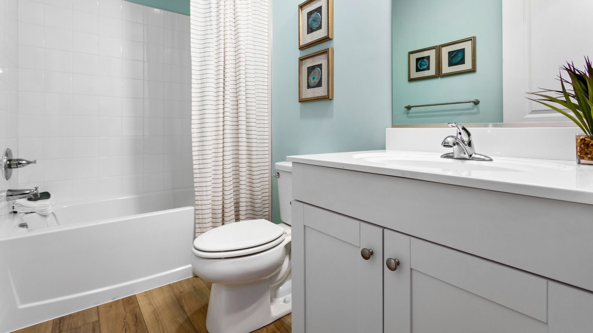 Full bathroom with shower/tub combo in a DRB Homes Whitehall Model at the Village of College Park community.